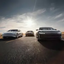 Three Lucid Airs driving down the highway.