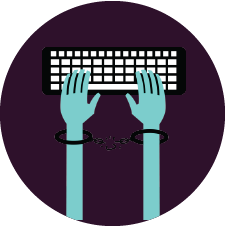 hands handcuffed while typing on keyboard