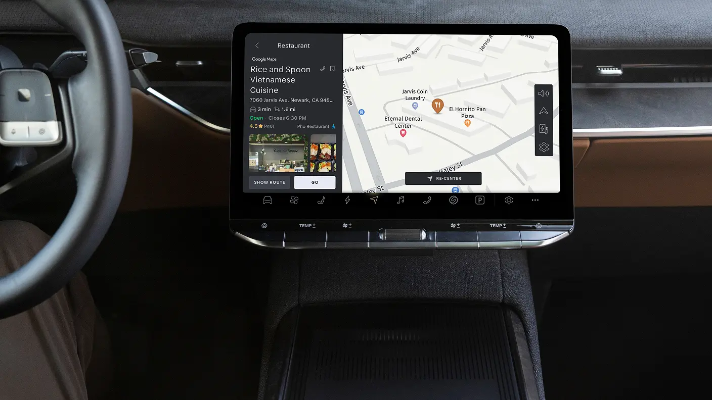 Car infotainment touchscreen displaying Google Maps with a restaurant search result for Rice and Spoon Vietnamese Cuisine in Newark, CA.