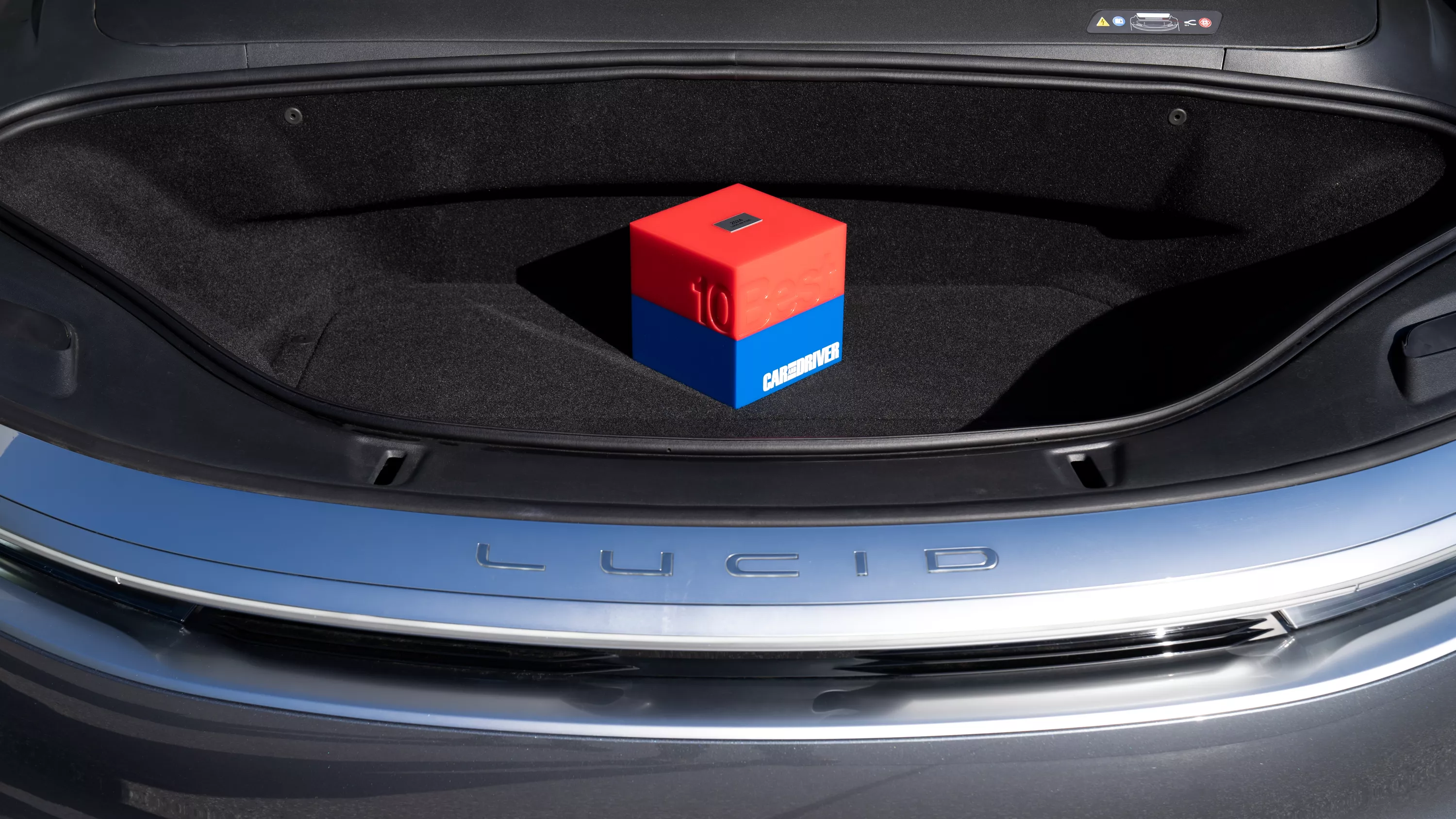 Car and Driver 10Best List award sitting in Lucid Air Pure frunk