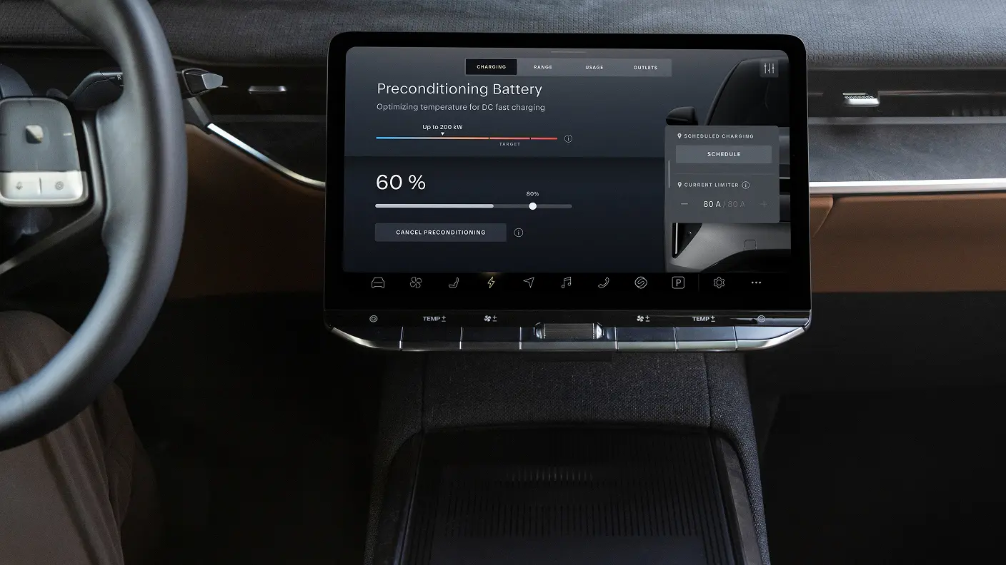 EV centre console touchscreen displaying a "Preconditioning Battery" charging screen at 60% with dark UI.
